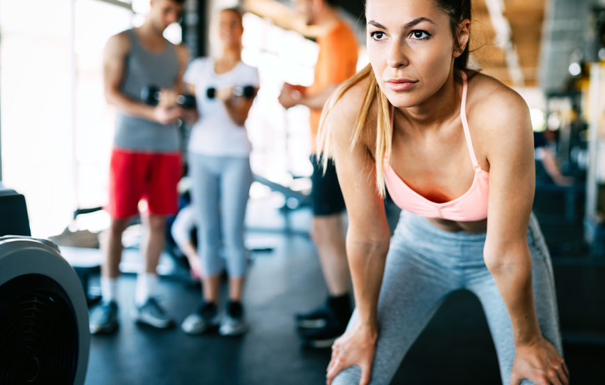 Woman wondering how to get motivated to work out at the gym when she doesn’t want to.