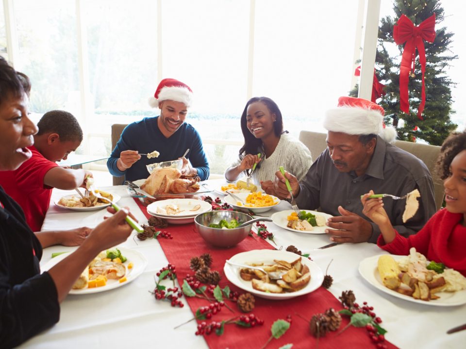 Family enjoying Christmas dinner together.