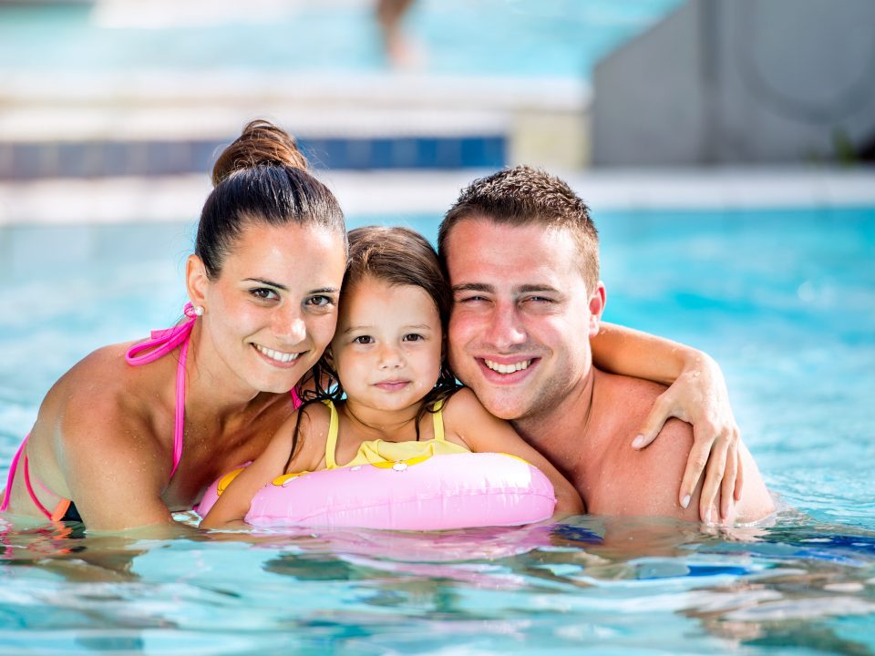 Family in swimming pool
