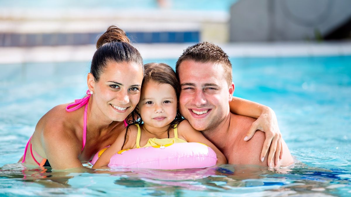 Family in swimming pool