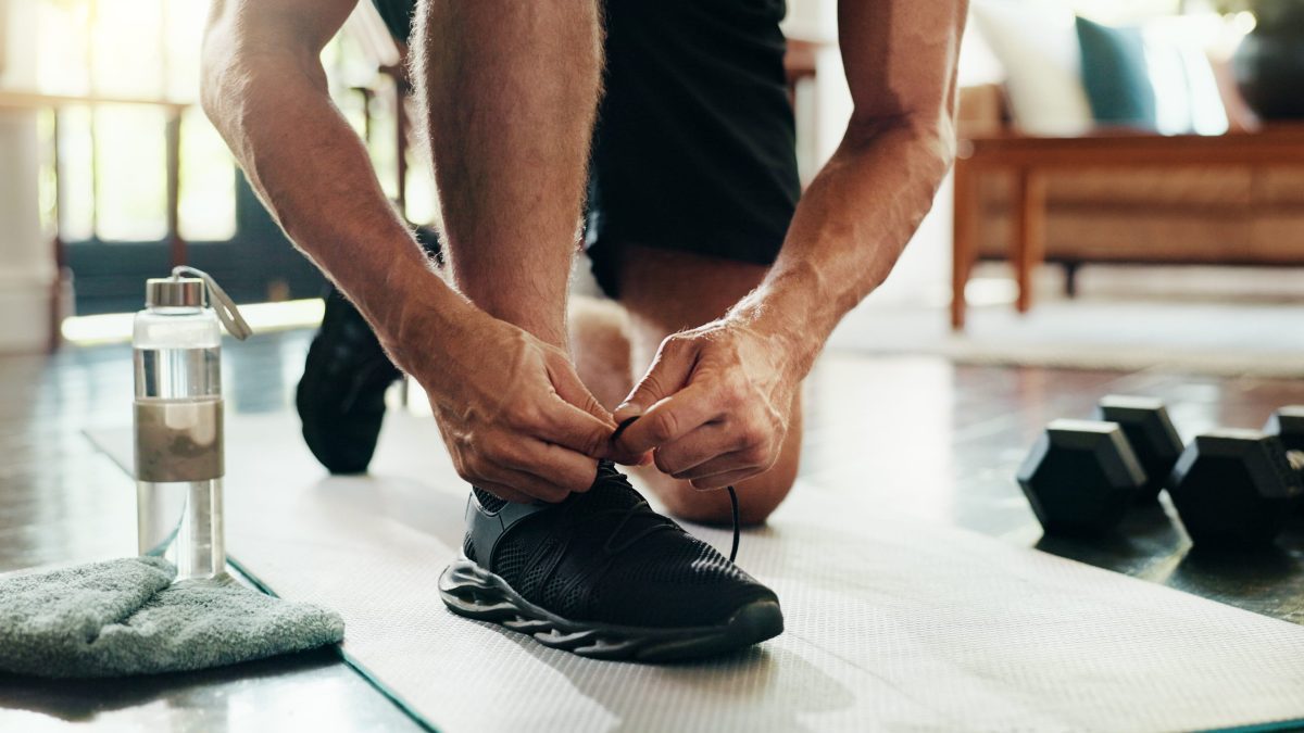 Man tying his tennis shoes