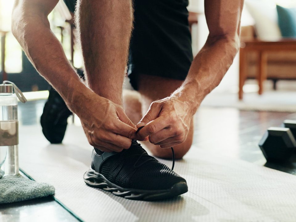 Man tying his tennis shoes