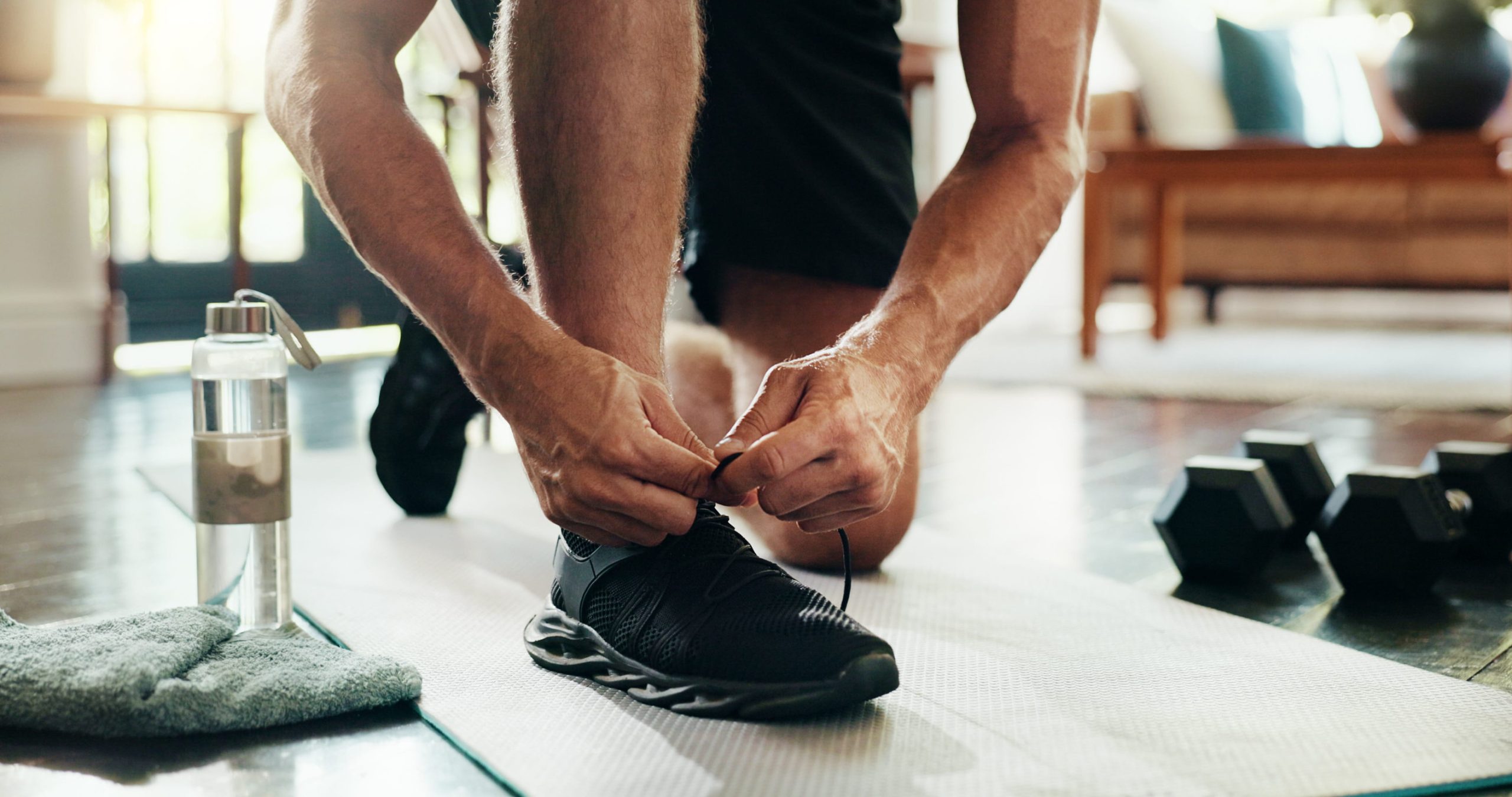 Man tying his tennis shoes