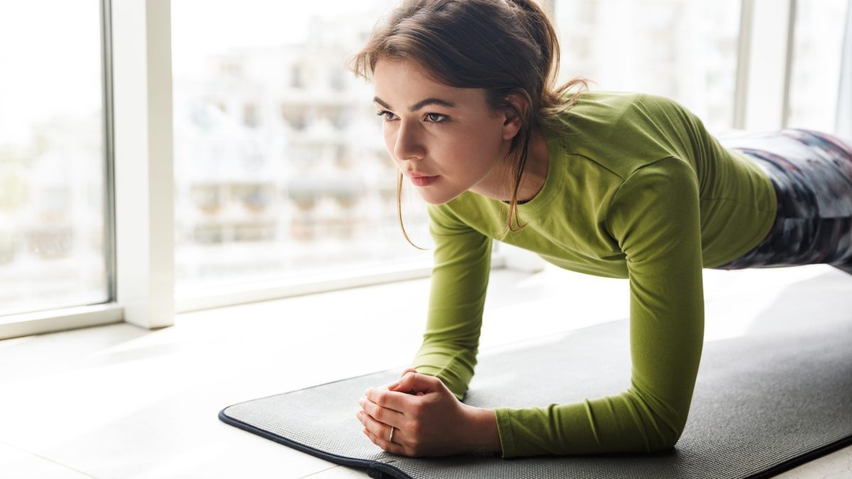 Woman working out indoors in winter