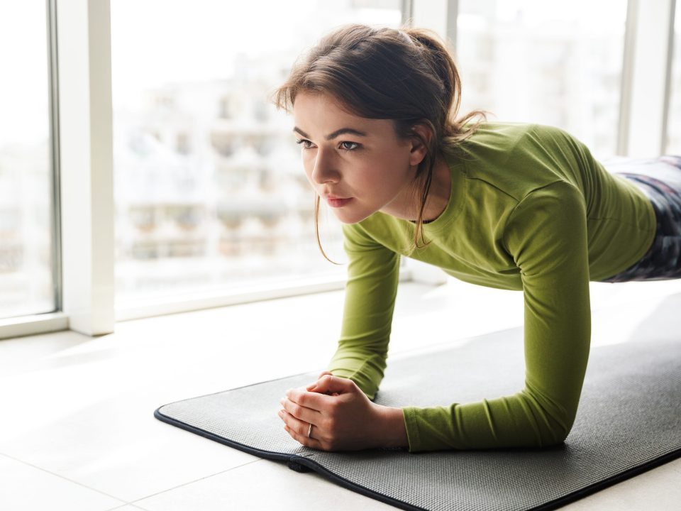 Woman working out indoors in winter