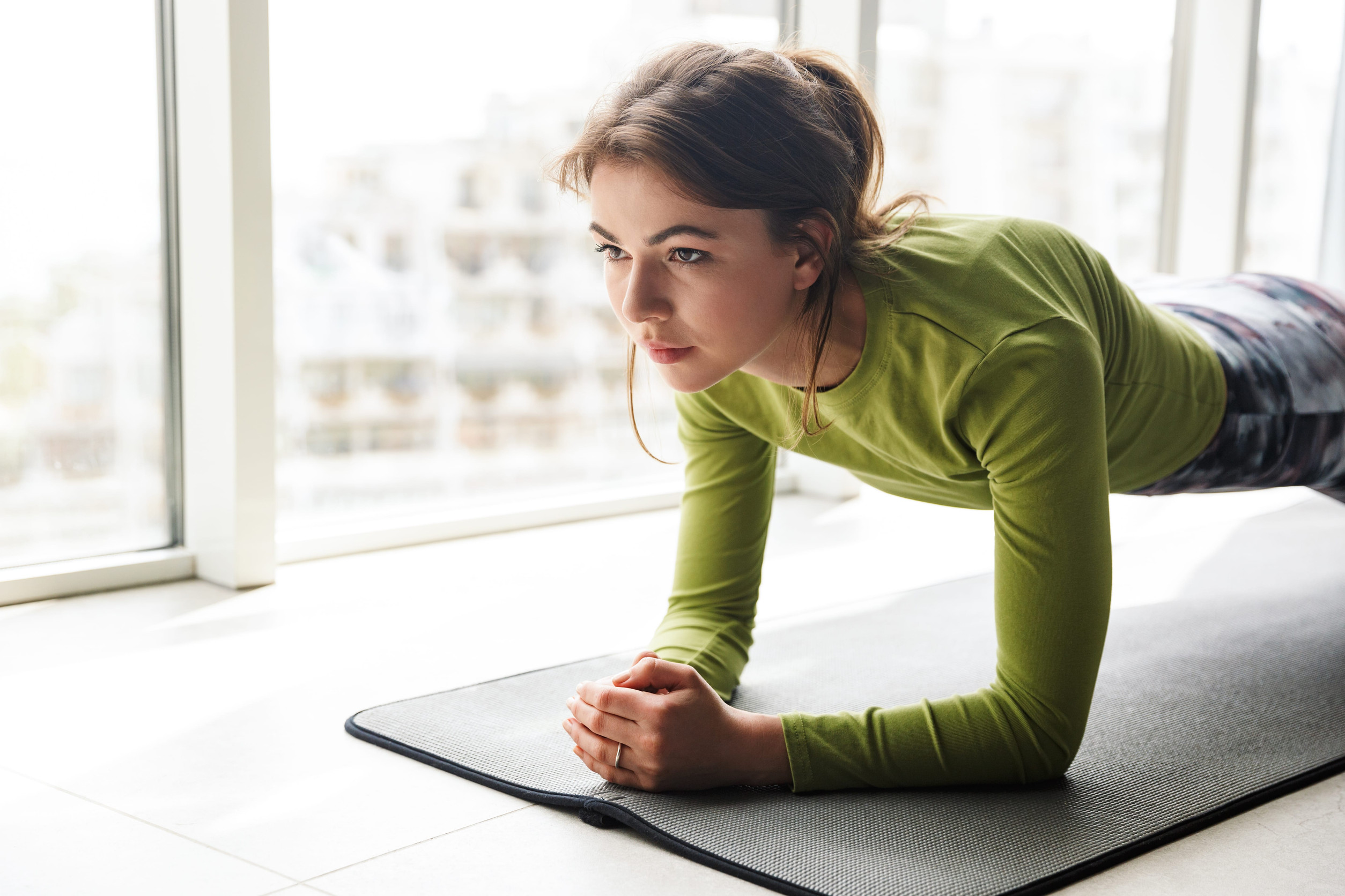 Woman working out indoors in winter